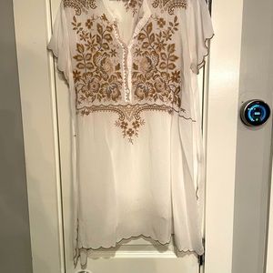 Silk tunic.Sheer, looks great with a white tank. Hits 6 in. above knee